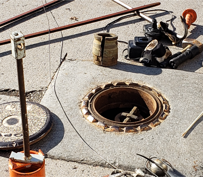 spill bucket with the cover removed and the cap to the drop tube in place